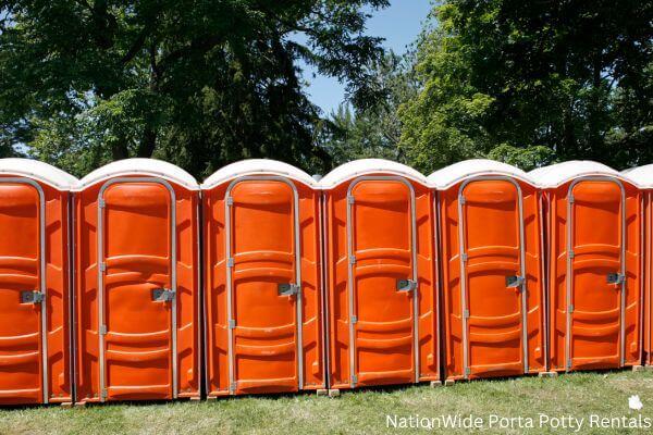 a lineup of clean and well-maintained portable loos for workers in Montcalm, WV