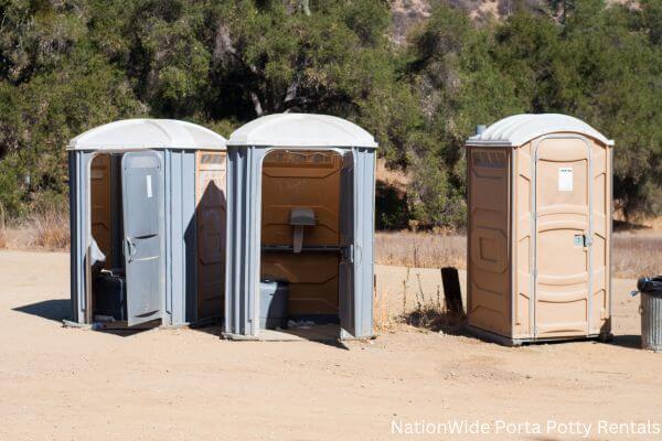 a clean row of portable restrooms for outdoor weddings or festivals in Ranger, WV